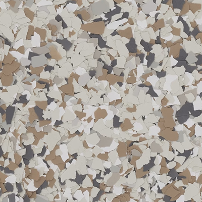 Close-up of a terrazzo pattern with irregular beige, taupe, gray, and white chips.