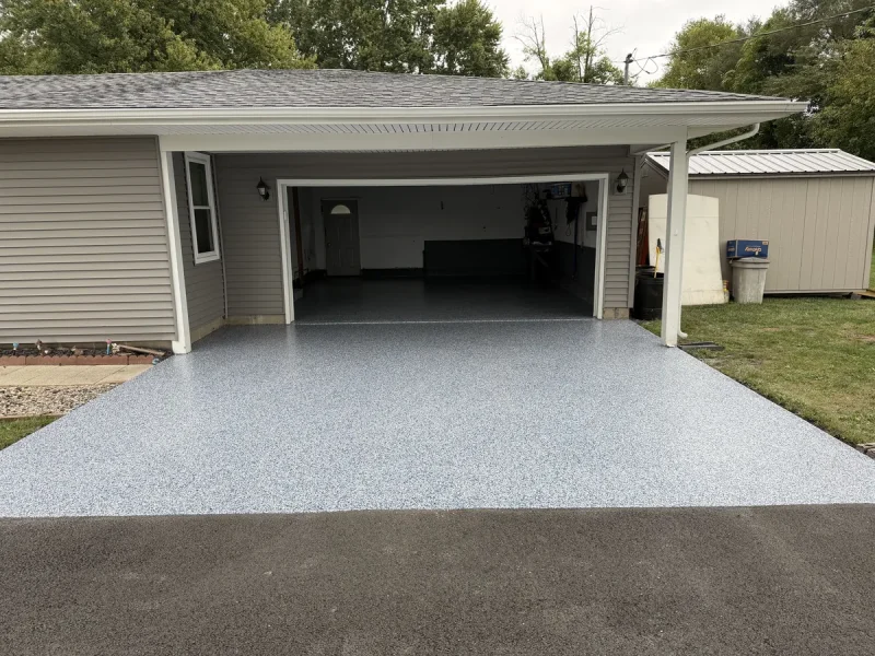 The same driveway floor after a Comer & Cross coating