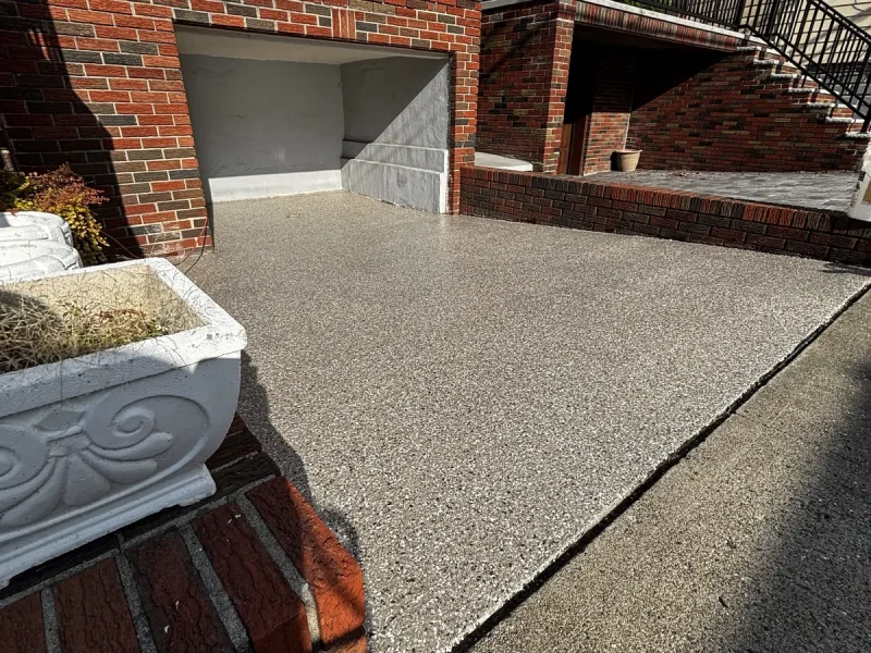 The same driveway floor after a Comer & Cross coating