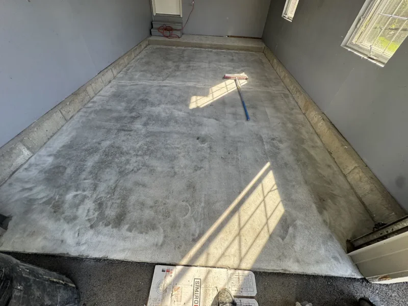 Garage floor before a Comer & Cross coating