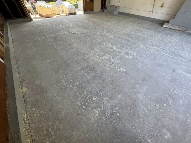 Garage floor before a Comer & Cross coating
