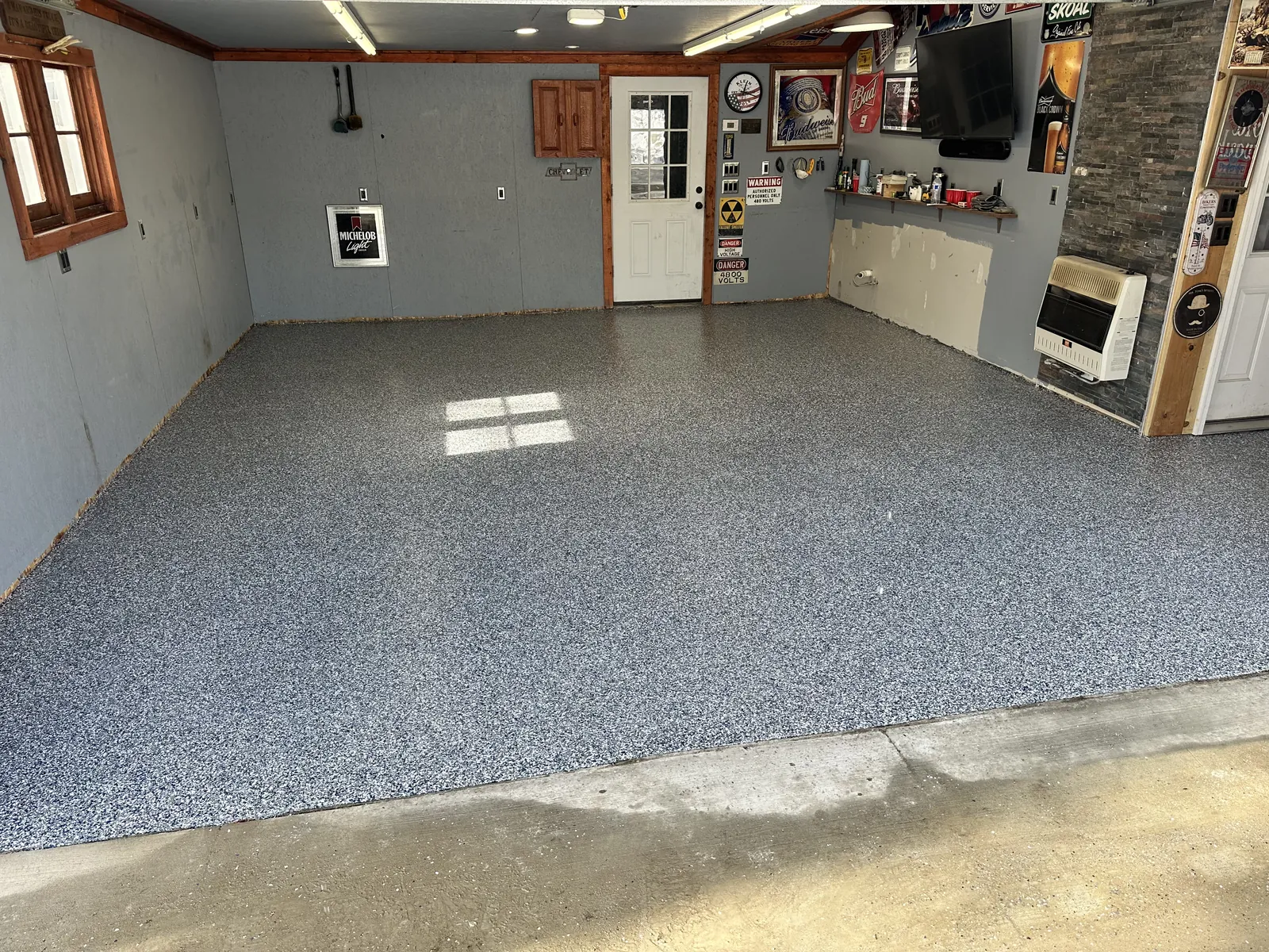 Freshly coated garage floor with decorative flake finish